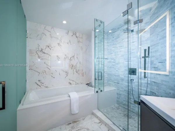 a bathroom with a toilet and shower