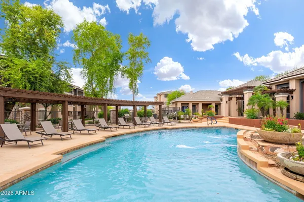 a view of a chairs and table in a patio