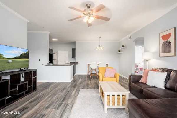 a living room with furniture and a flat screen tv