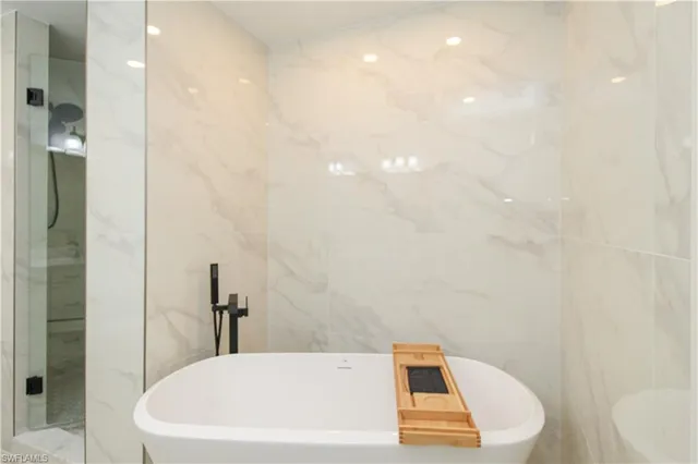 a bathroom with a white tub