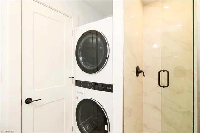 a close view of a utility room with dryer and washer