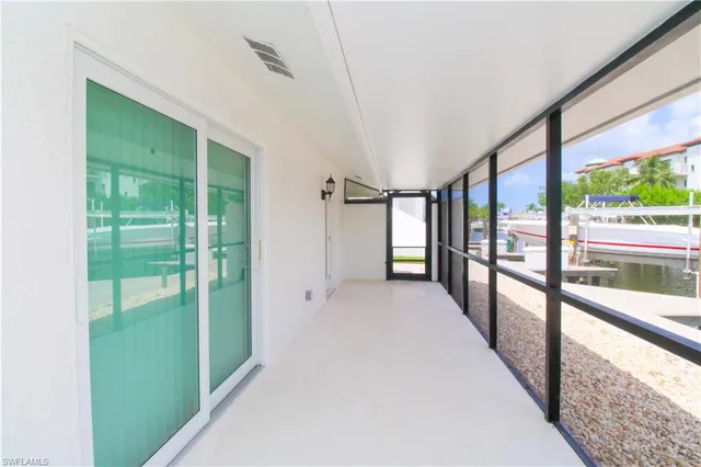 a view of an entryway with a floor to ceiling window