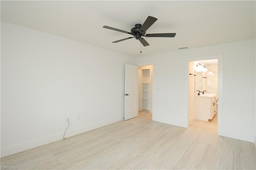 1435 Curlew Avenue, Unit 4 Naples, FL 34102 - Photo 9 of 26 a view of a livingroom with a ceiling fan and wooden floor