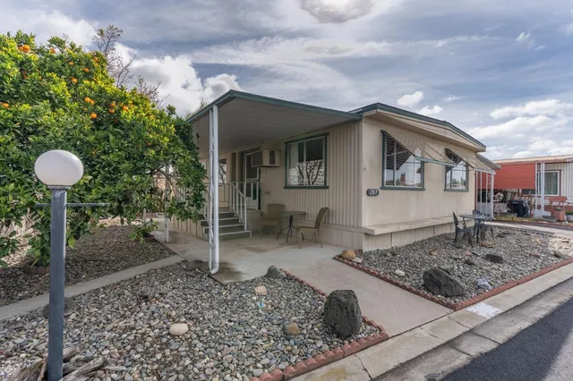 a front view of a house with garden