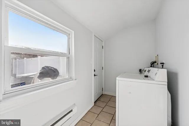 a utility room with dryer and washer
