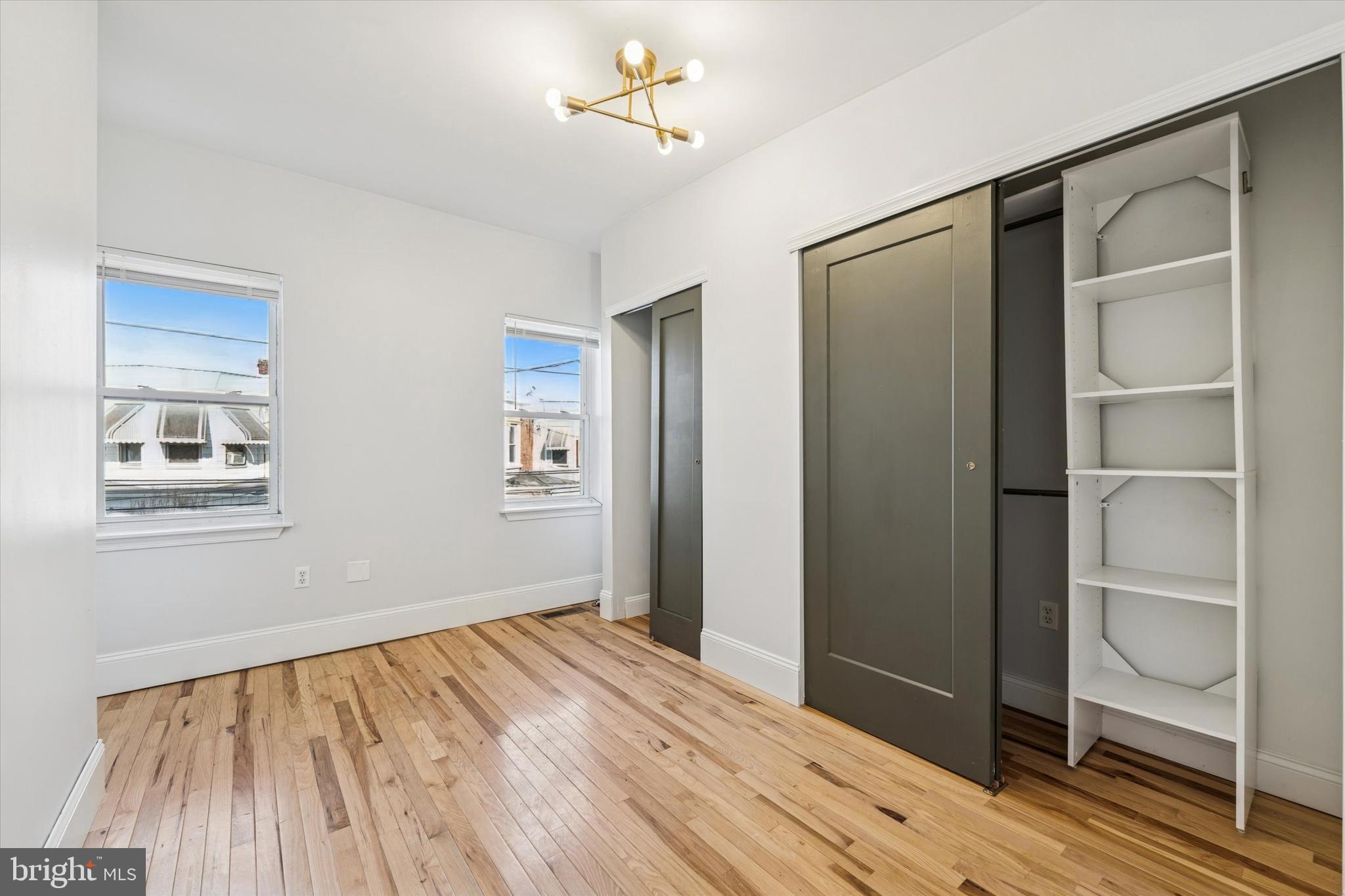 2814 West Stiles Street Philadelphia, PA 19121 - Photo 19 of 34 a view of an empty room with wooden floor and a window