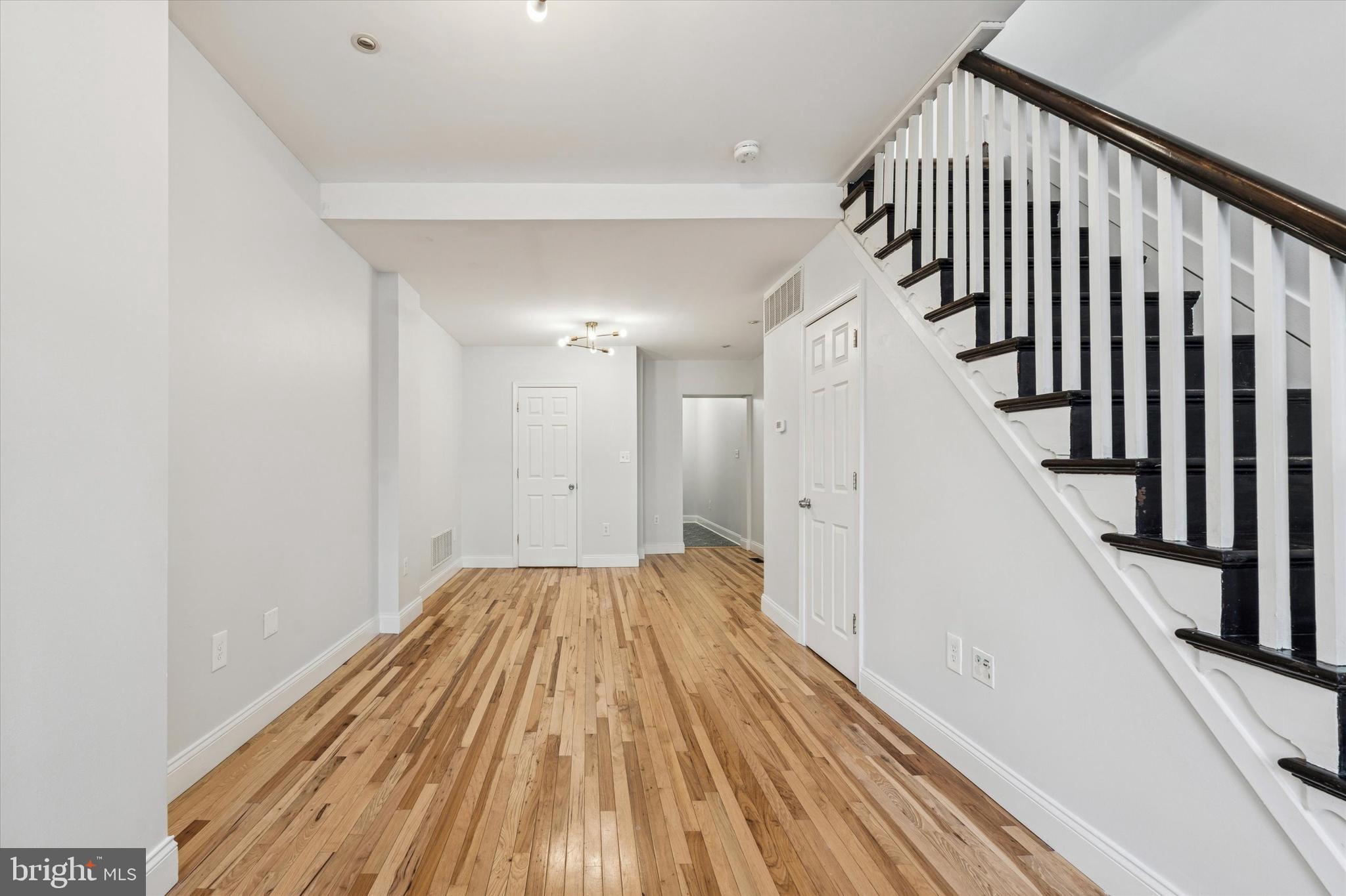 2814 West Stiles Street Philadelphia, PA 19121 - Photo 3 of 34 a view of a hallway with wooden floor and staircase