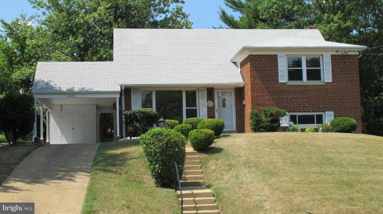 6703 Cabin John Road Springfield, VA 22150 - Photo 1 of 10 a front view of a house with garden