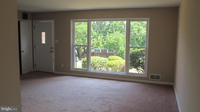 6703 Cabin John Road Springfield, VA 22150 - Photo 3 of 10 a view of a room that has a window in it