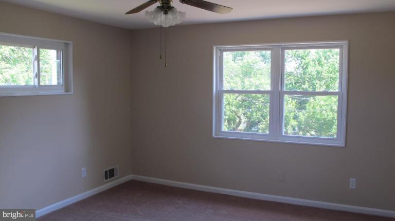 6703 Cabin John Road Springfield, VA 22150 - Photo 5 of 10 an empty room with a window