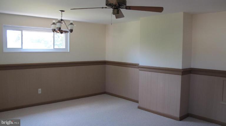 6703 Cabin John Road Springfield, VA 22150 - Photo 6 of 10 an empty room with a window