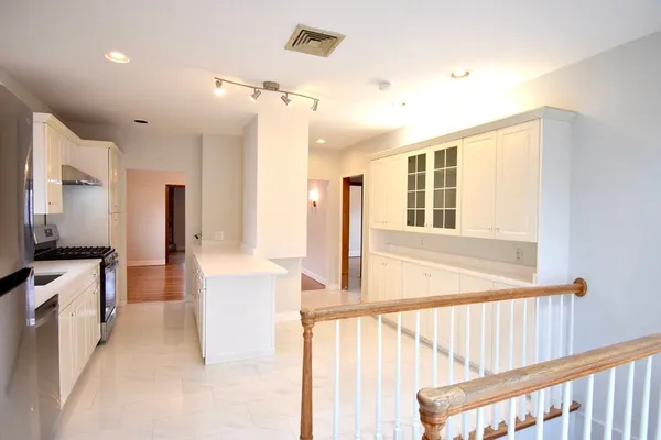 a view of a kitchen with a sink and a window