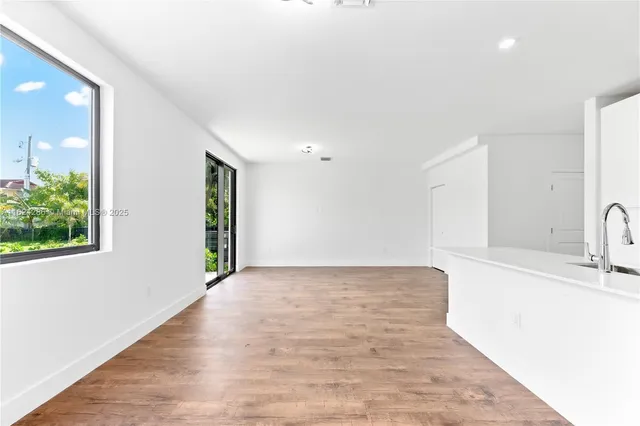 a view of a kitchen with a sink and dishwasher