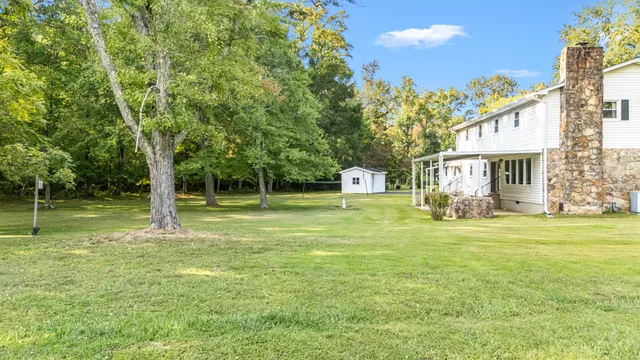 a house with swimming pool in front of it