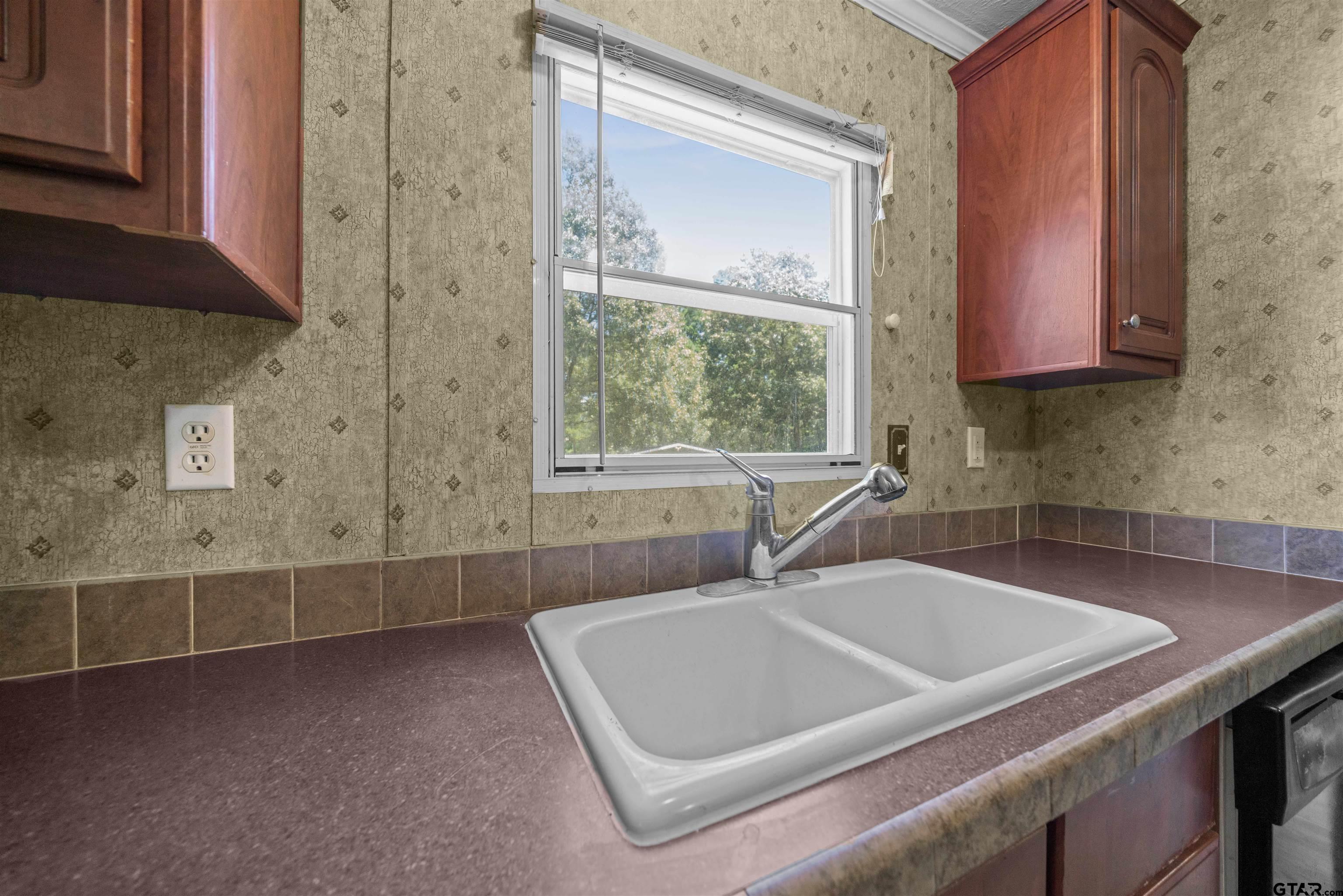 5611 Holiday Hills Road Tyler, TX 75708 - Photo 16 of 38 a bathroom with a sink and a bathtub