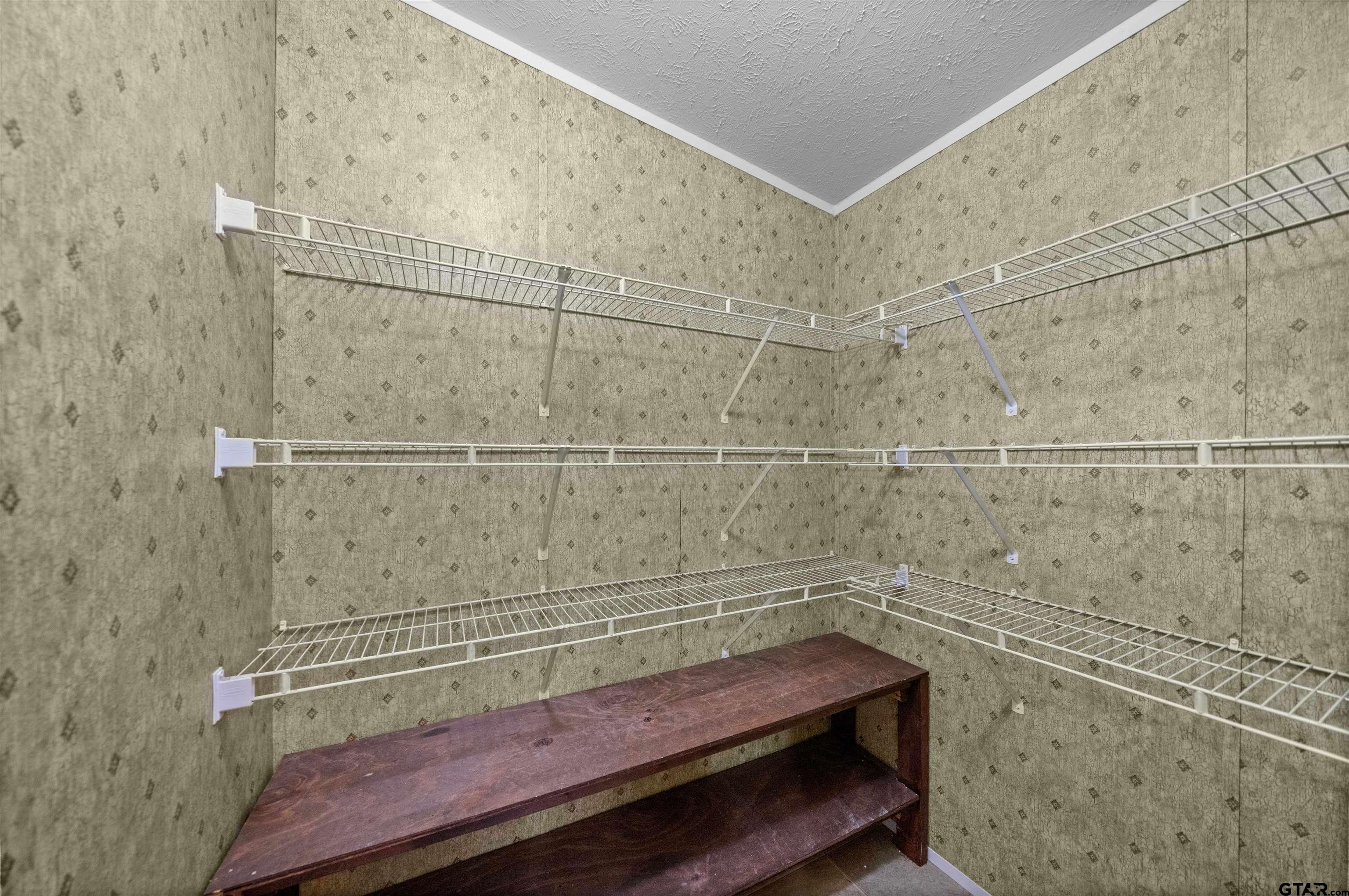 5611 Holiday Hills Road Tyler, TX 75708 - Photo 18 of 38 a bathroom with a sink and vanity