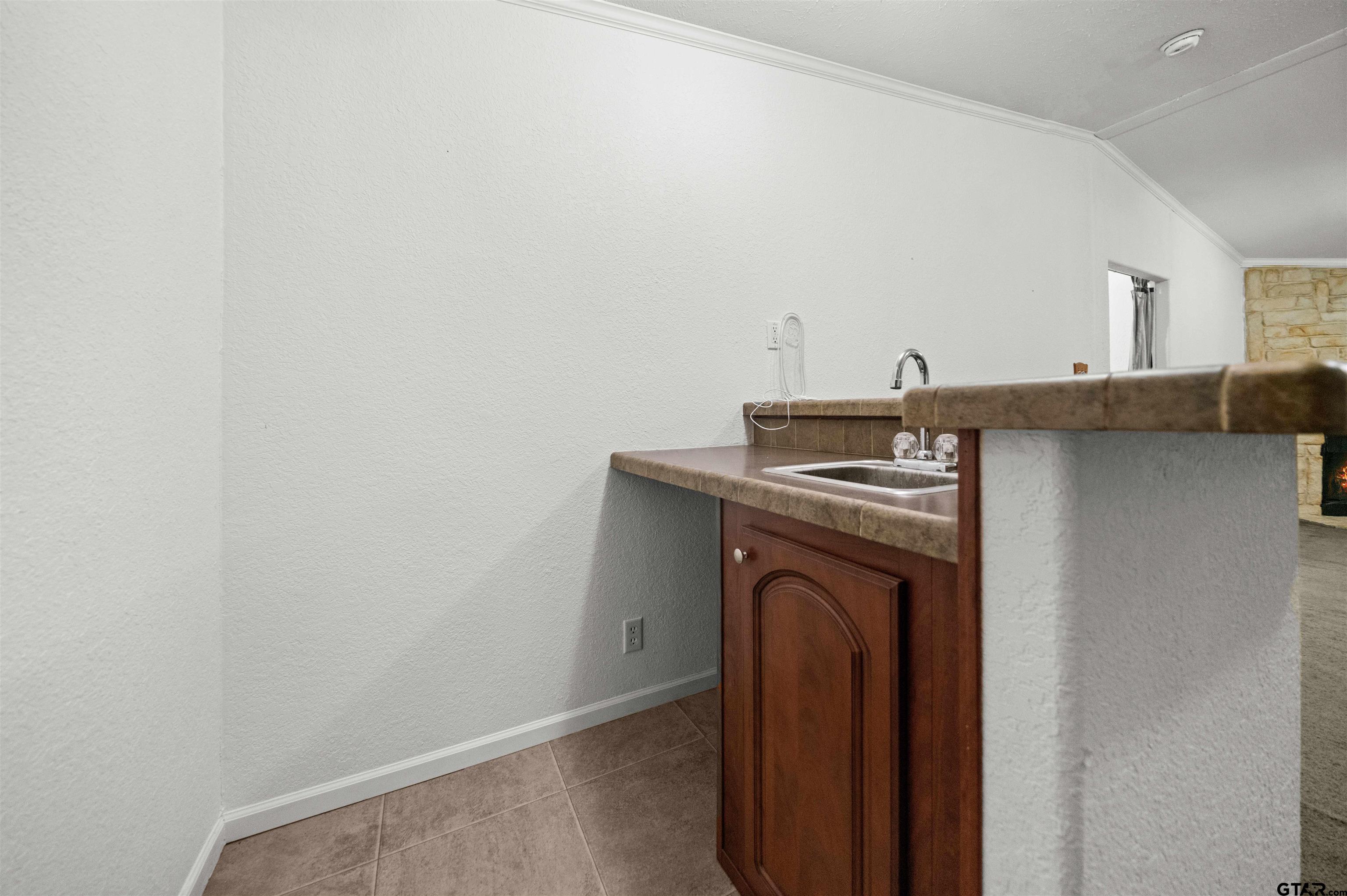 5611 Holiday Hills Road Tyler, TX 75708 - Photo 23 of 38 a view of a storage and utility room with washer and dryer