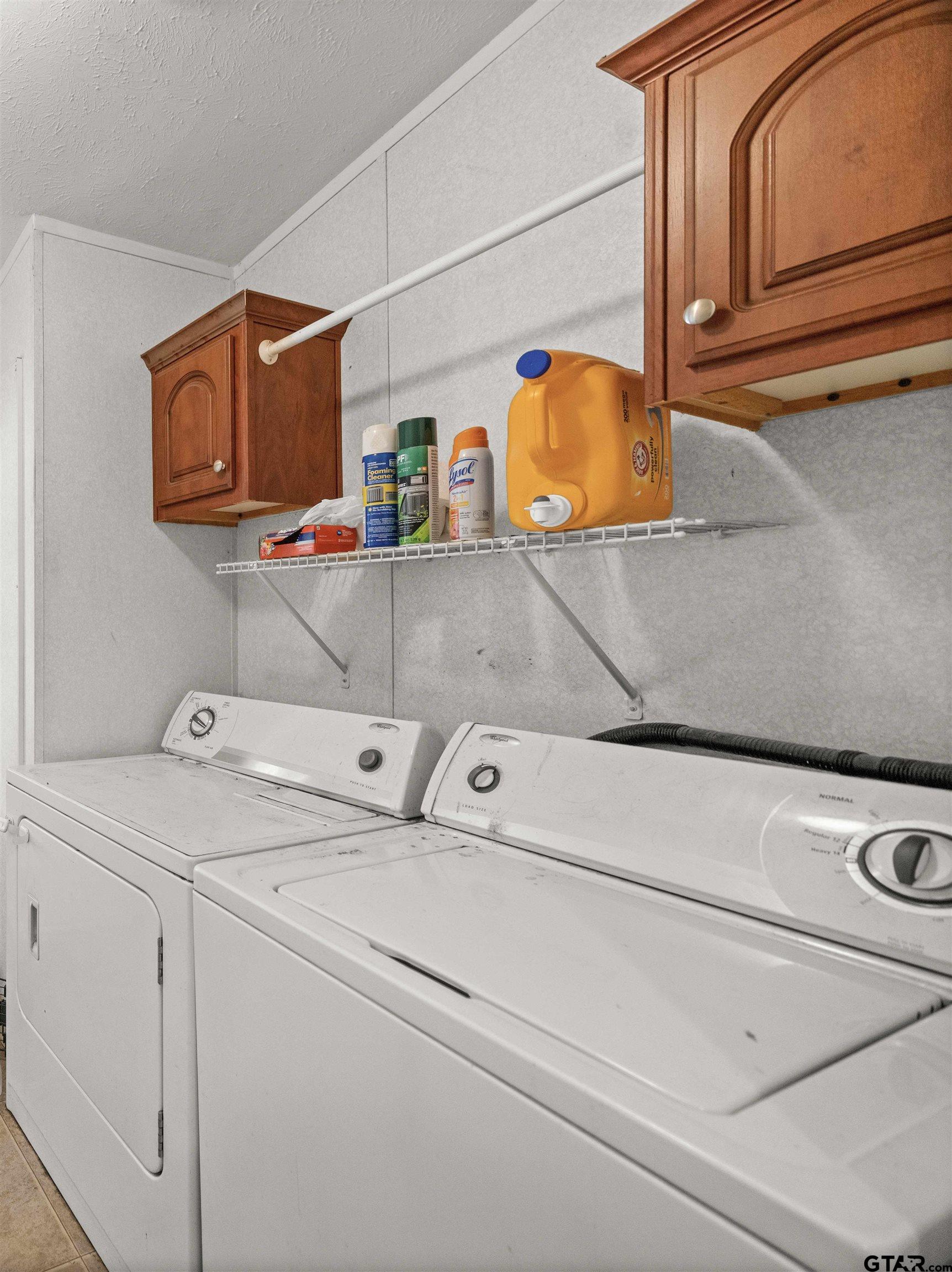 5611 Holiday Hills Road Tyler, TX 75708 - Photo 27 of 38 a utility room with dryer and washer
