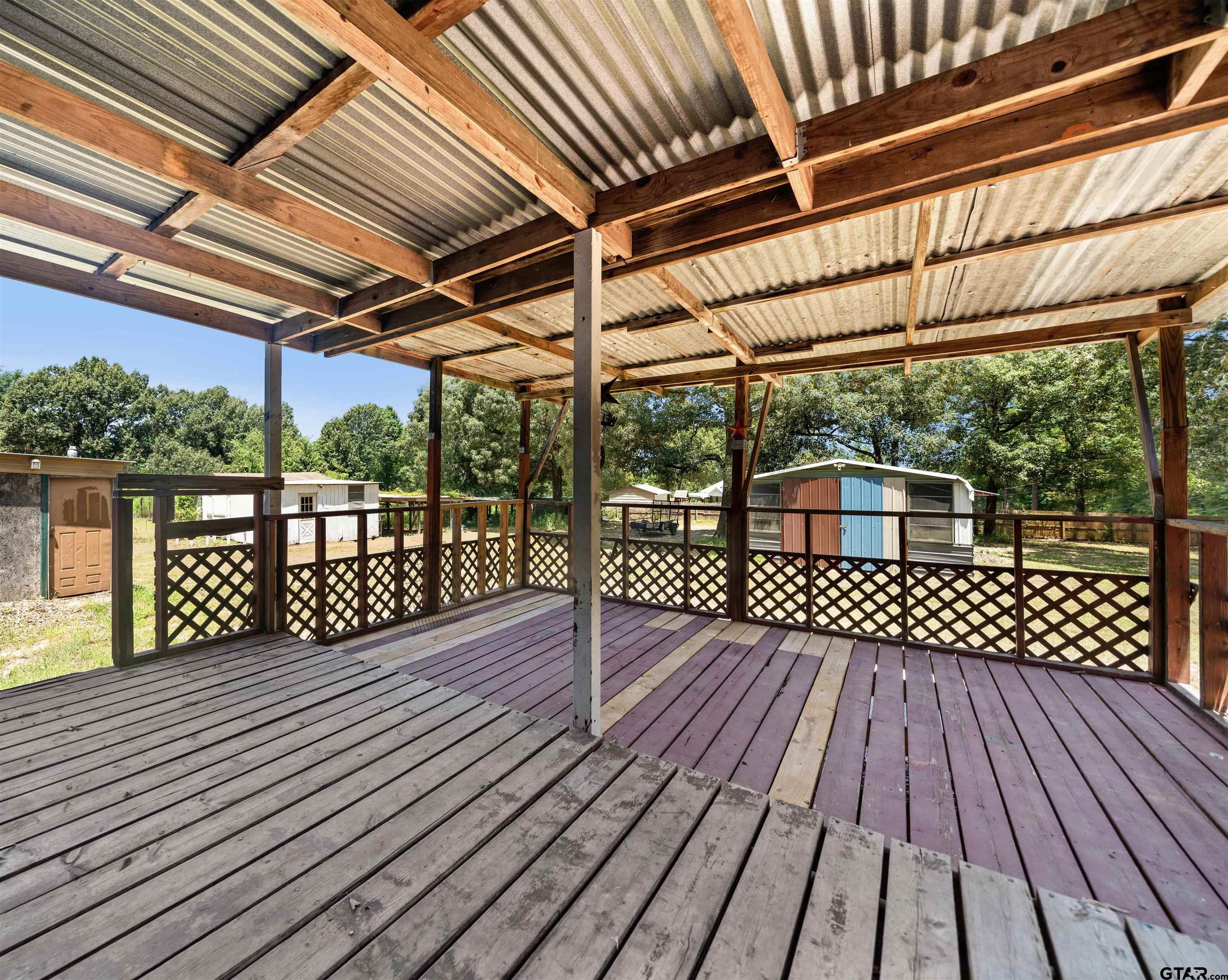 5611 Holiday Hills Road Tyler, TX 75708 - Photo 28 of 38 a view of outdoor space with wooden deck