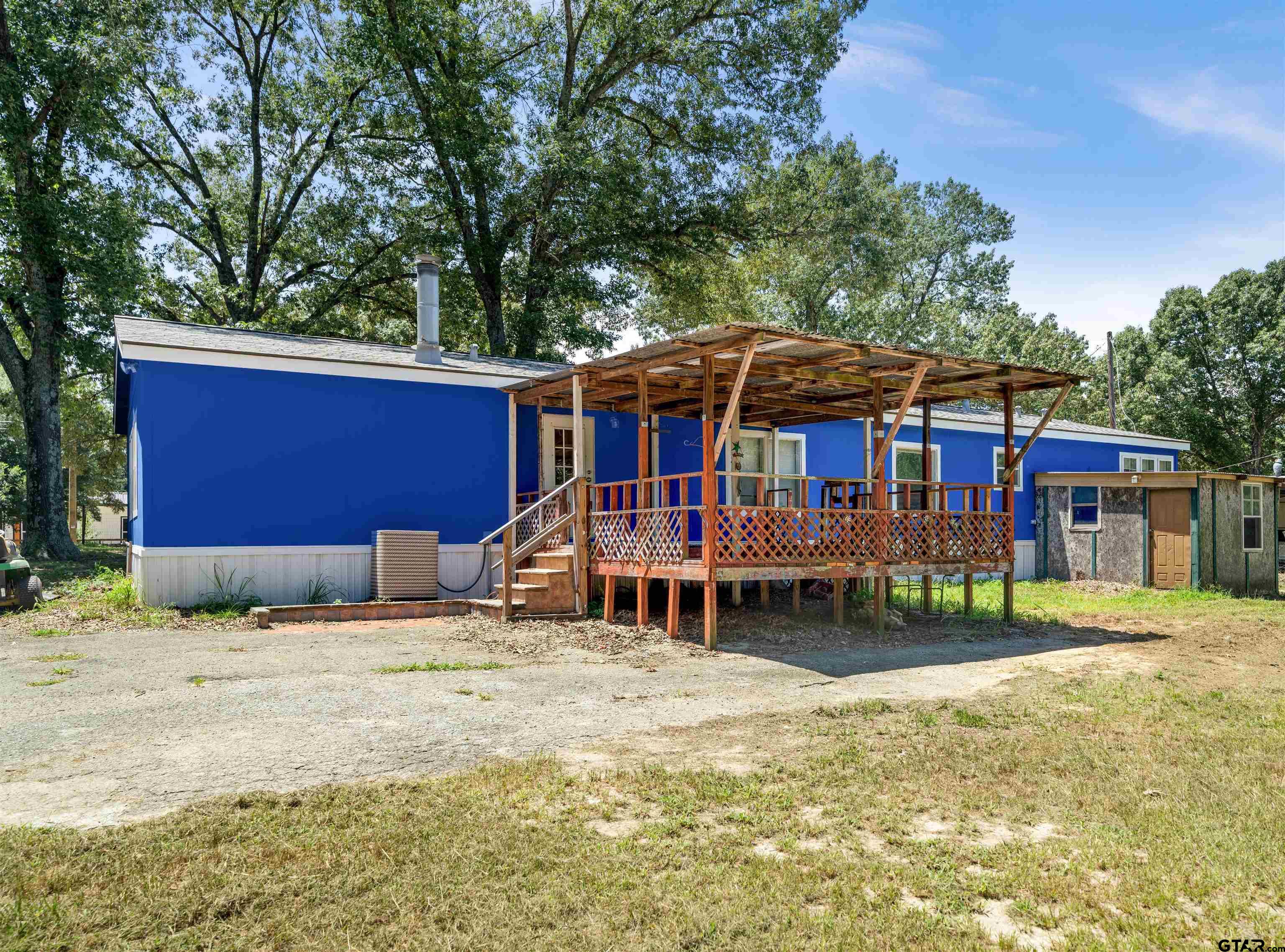 5611 Holiday Hills Road Tyler, TX 75708 - Photo 31 of 38 a view of a house with a yard