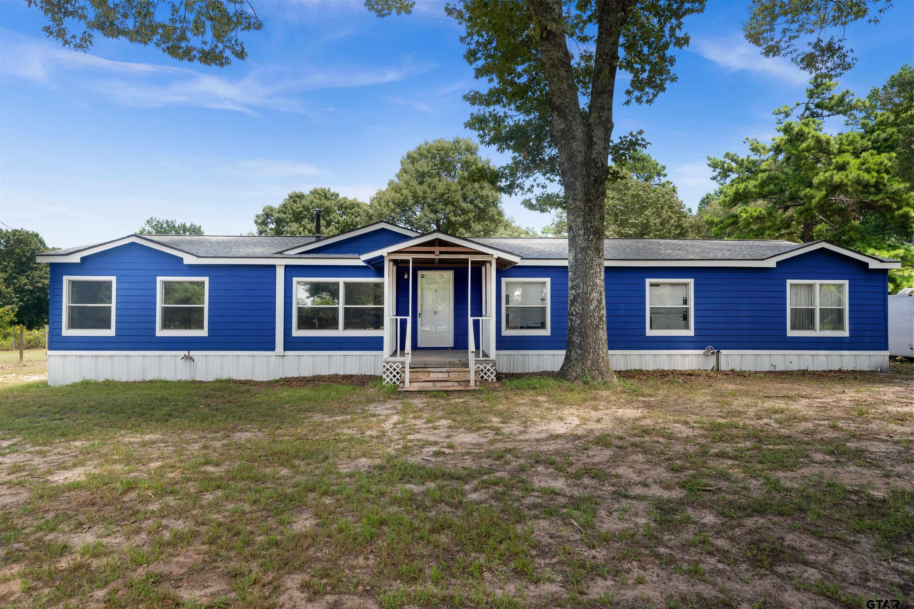 5611 Holiday Hills Road Tyler, TX 75708 - Photo 33 of 38 a view of a house with a yard