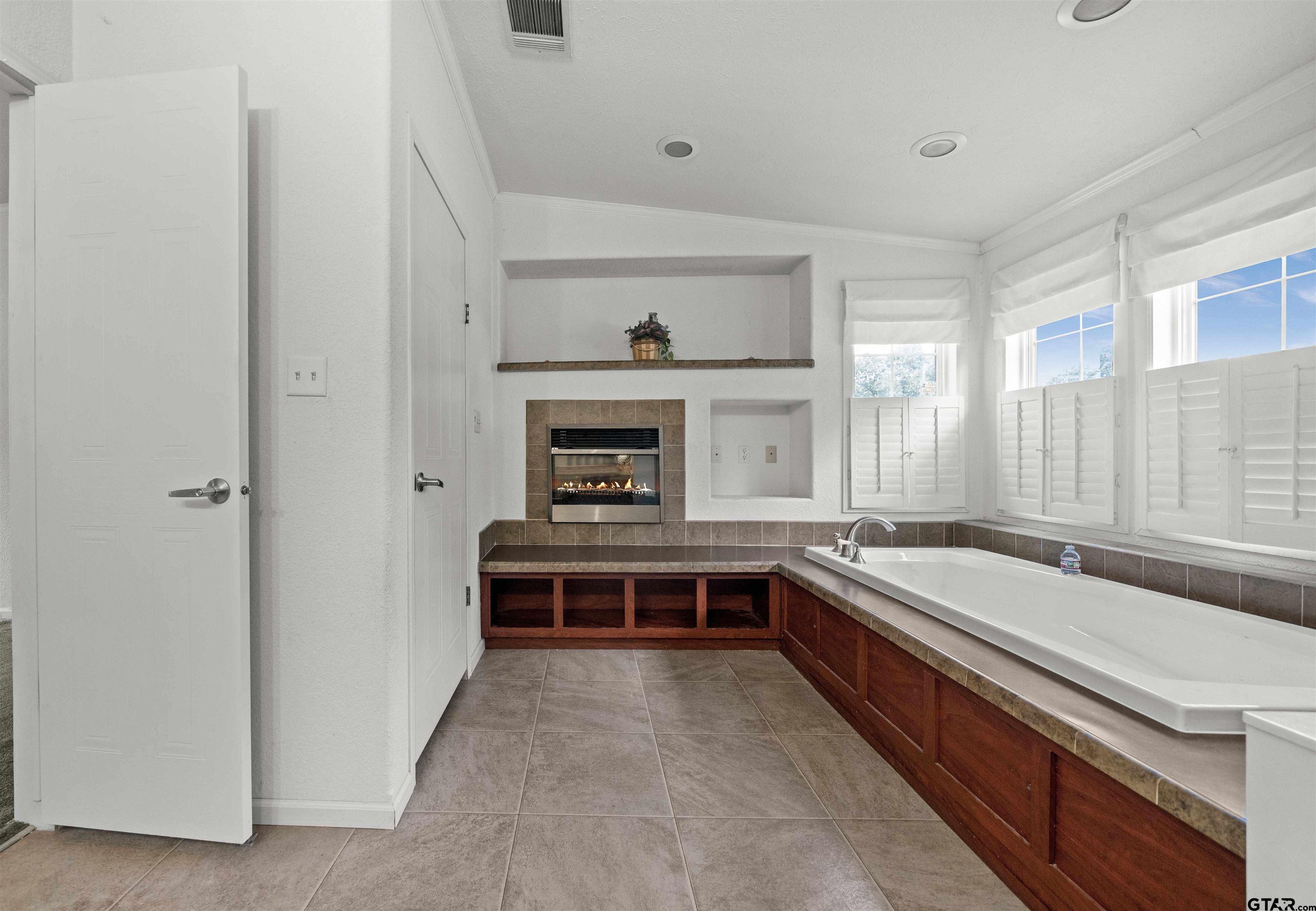 5611 Holiday Hills Road Tyler, TX 75708 - Photo 9 of 38 a kitchen with a stove and a sink