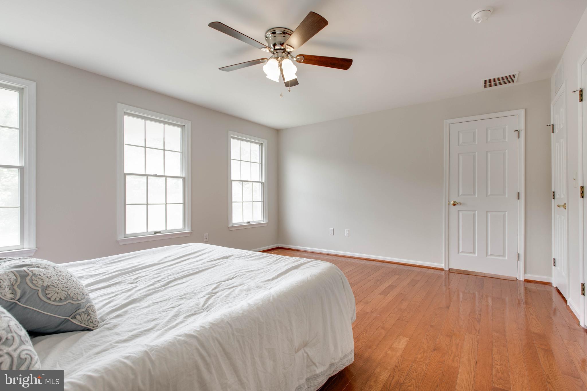 574 Pasture Brook Road Severn, MD 21144 - Photo 39 of 76 a bedroom with a large bed and a window