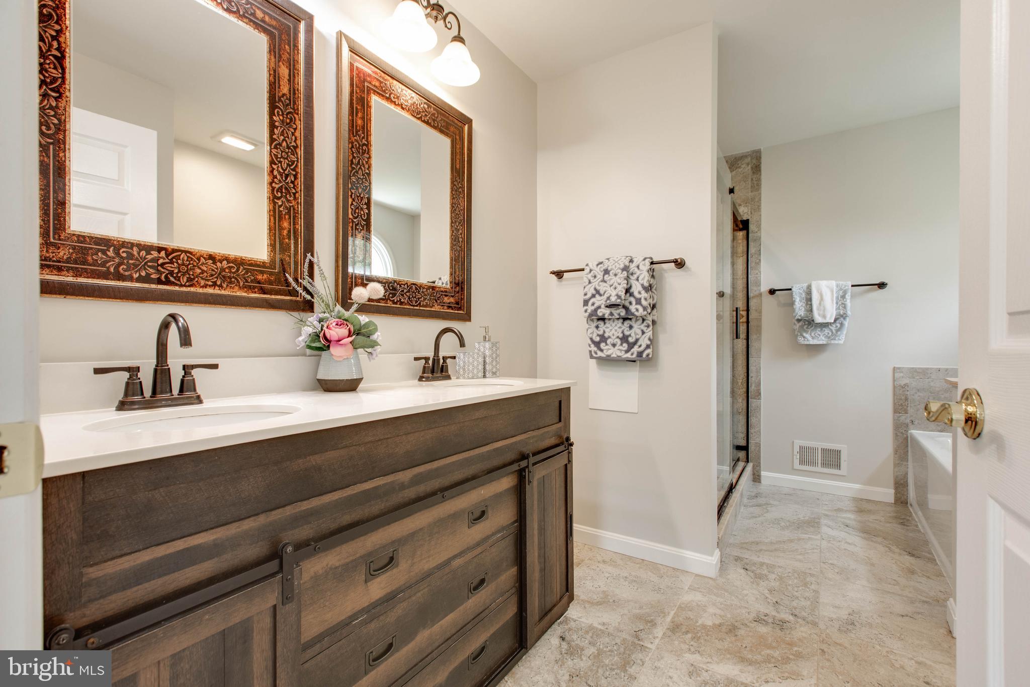 574 Pasture Brook Road Severn, MD 21144 - Photo 42 of 76 a bathroom with a sink and a mirror