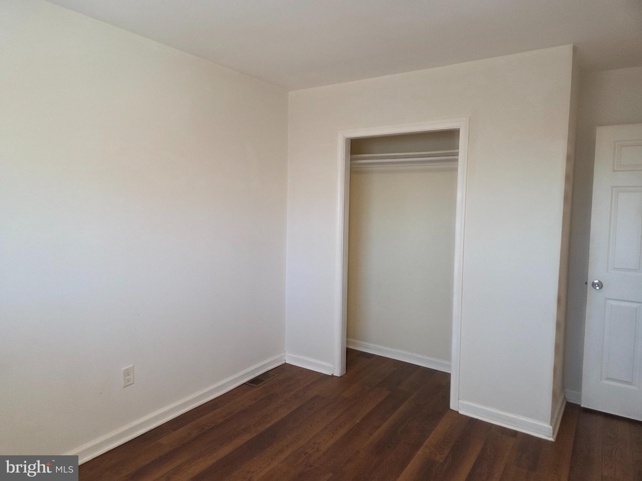 561 Homestead Road, Unit A Wilmington, DE 19805 - Photo 11 of 11 a view of an empty room with wooden floor and closet
