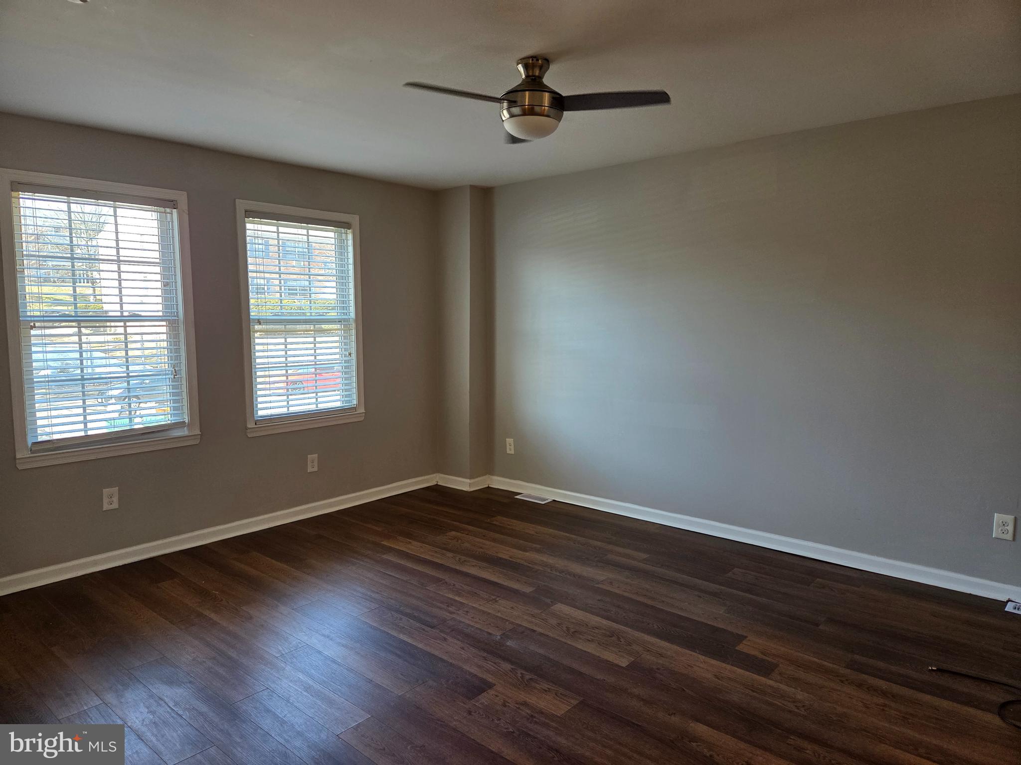 561 Homestead Road, Unit A Wilmington, DE 19805 - Photo 4 of 11 a view of an empty room with wooden floor and a window