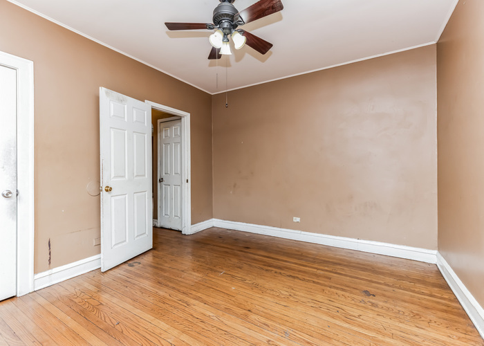10805 South Normal Avenue Chicago, IL 60628 - Photo 18 of 26 wooden floor in an empty room