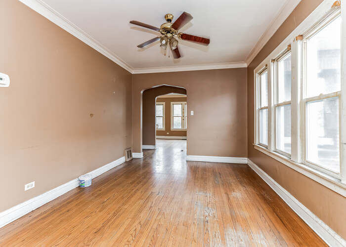 10805 South Normal Avenue Chicago, IL 60628 - Photo 7 of 26 wooden floor in an empty room with a window