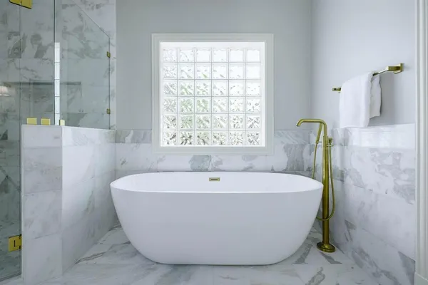 a white bath tub sitting in a bathroom
