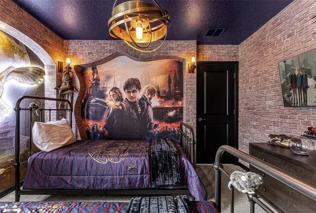 a spacious bedroom with a bed and a chandelier