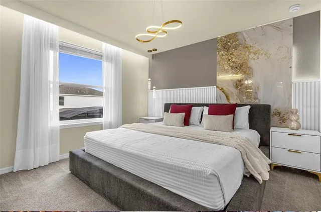 a bedroom with two beds and a window