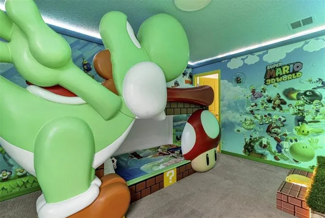 a bedroom with a bed and a chandelier