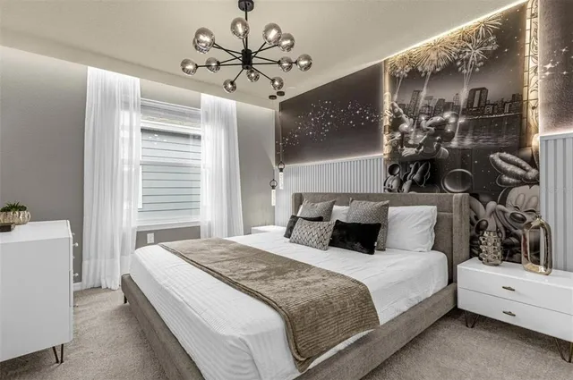 a en suite bathroom with a granite countertop sink and a mirror