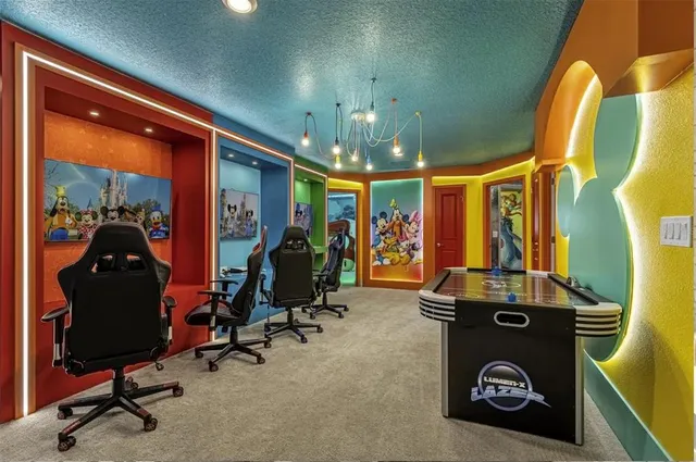 a view of a patio with table and chairs and wooden floor