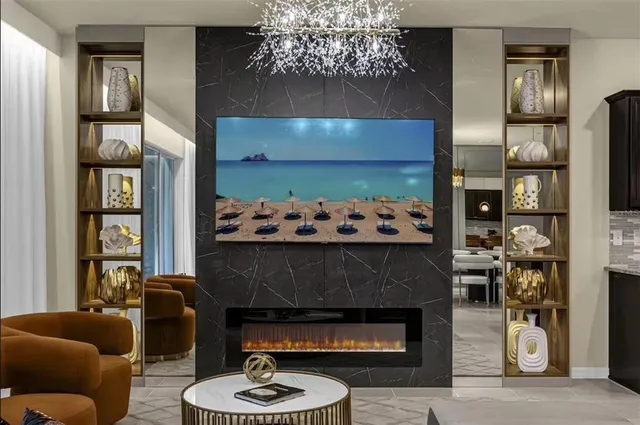 a kitchen with stainless steel appliances granite countertop a stove top oven a sink dishwasher and white cabinets