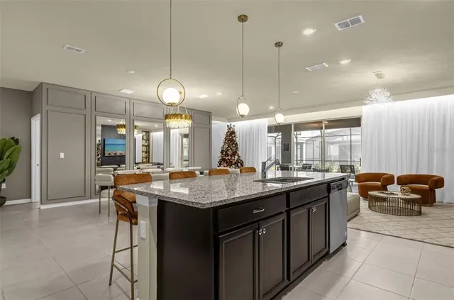 a view of a dining room with furniture wooden floor and chandelier
