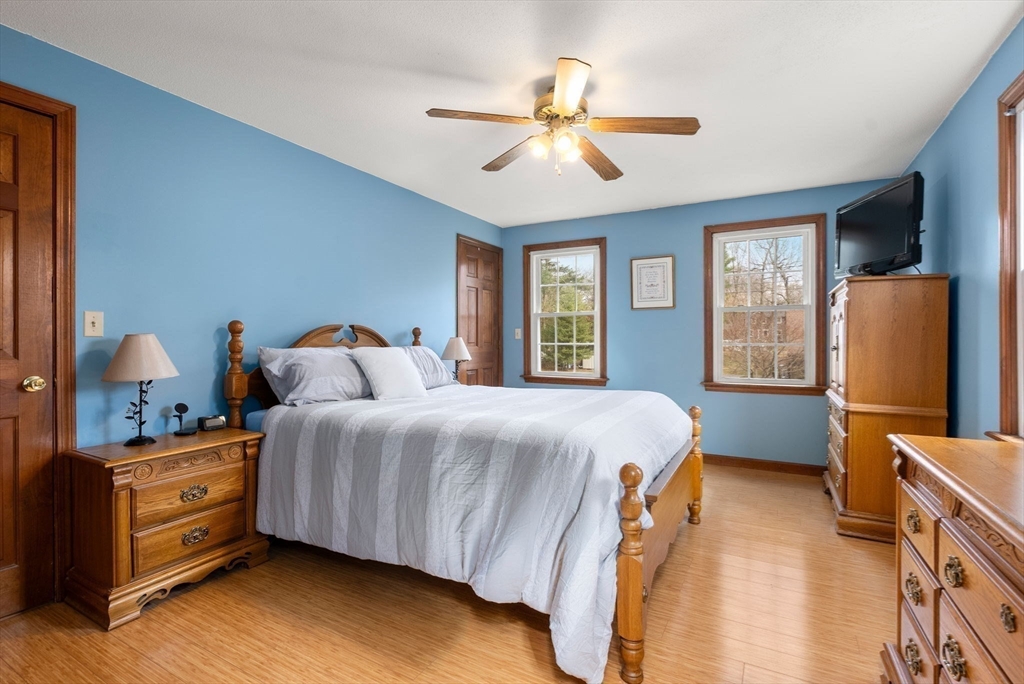 5 Blueberry Ridge Westfield, MA 01085 - Photo 17 of 34 a bedroom with a bed and wooden floor