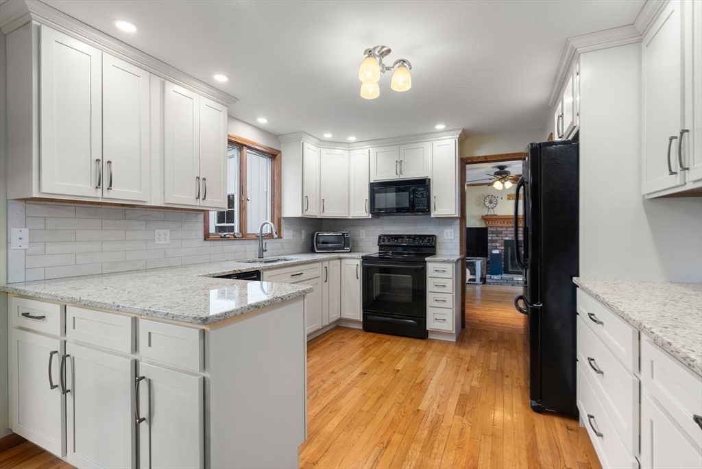 5 Blueberry Ridge Westfield, MA 01085 - Photo 7 of 34 a kitchen with kitchen island granite countertop a sink cabinets and stainless steel appliances