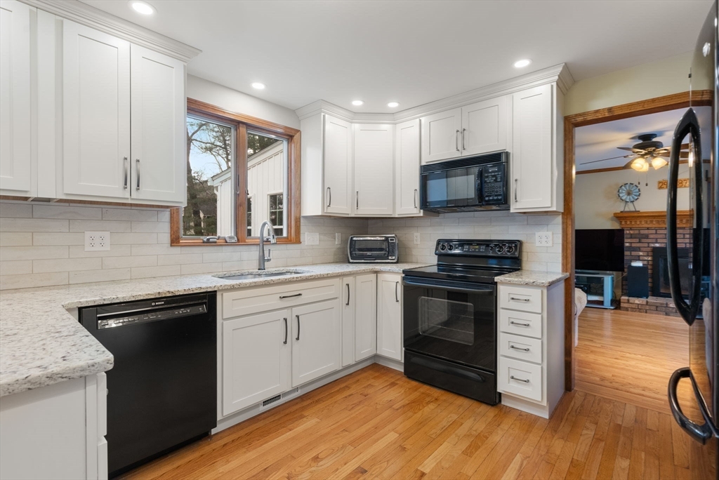 5 Blueberry Ridge Westfield, MA 01085 - Photo 8 of 34 a kitchen with stainless steel appliances granite countertop a stove a sink and a microwave