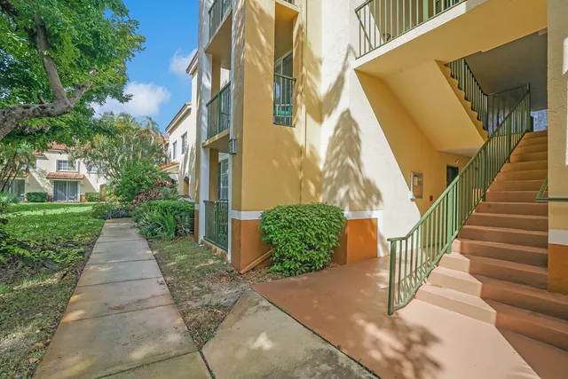 a view of a pathway both side of the house