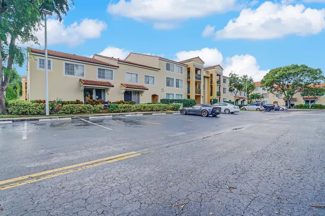 a view of a street with a building in the background