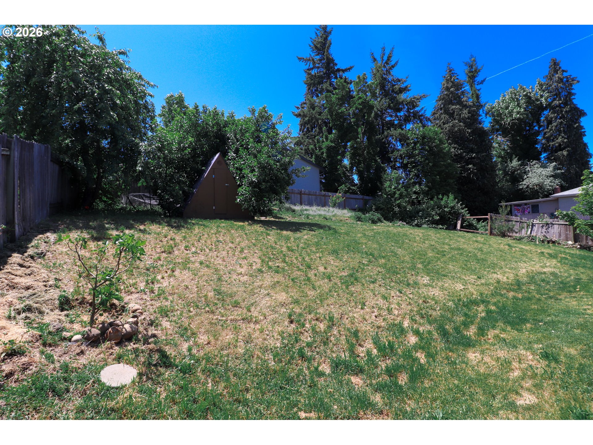 7077 Main Street Springfield, OR 97478 - Photo 33 of 34 a backyard of a house with lots of green space