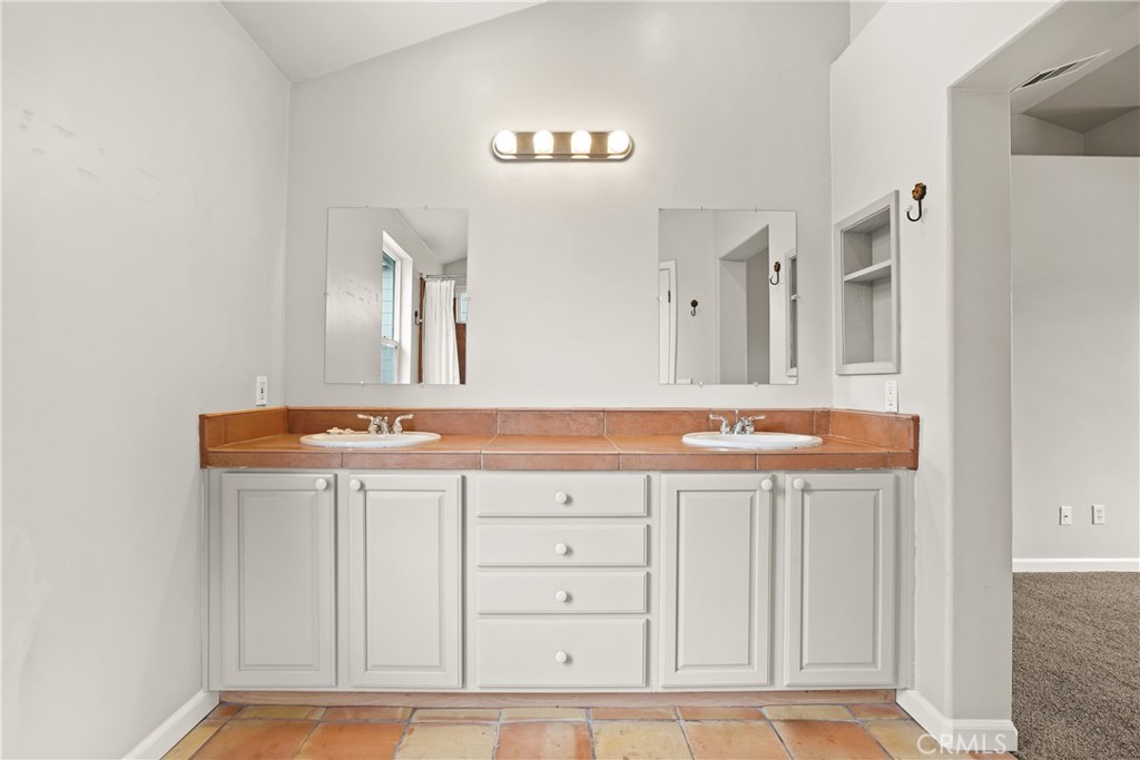 1691 Arbor Way Healdsburg, CA 95448 - Photo 13 of 25 a bathroom with a sink a vanity and a mirror