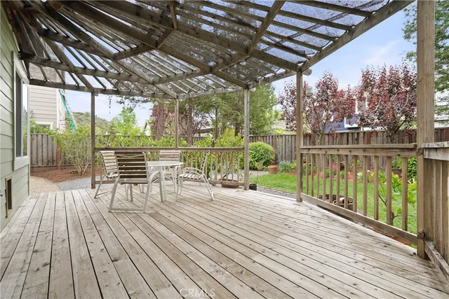 a view of a balcony with wooden floor