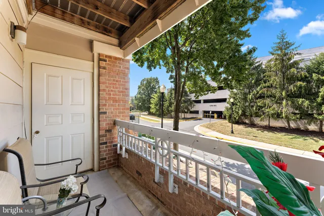 a view of a chair and table in the balcony