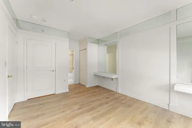 a bedroom with a bed and a shower